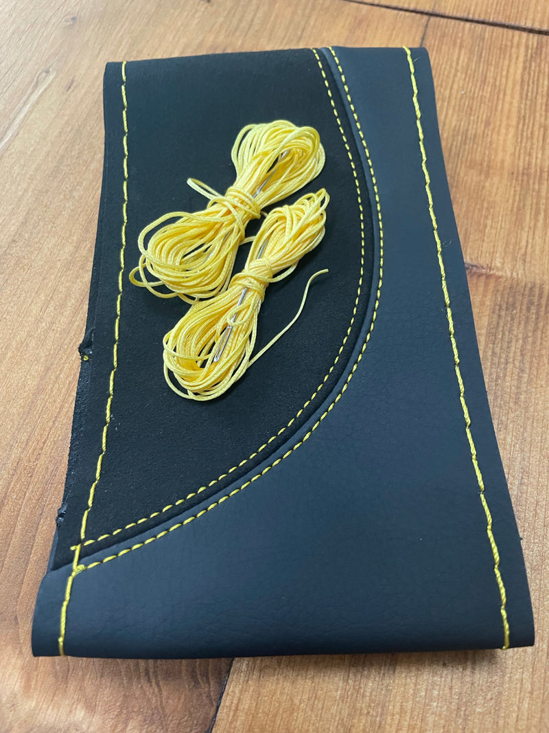 Braided steering wheel cover with yellow stitching