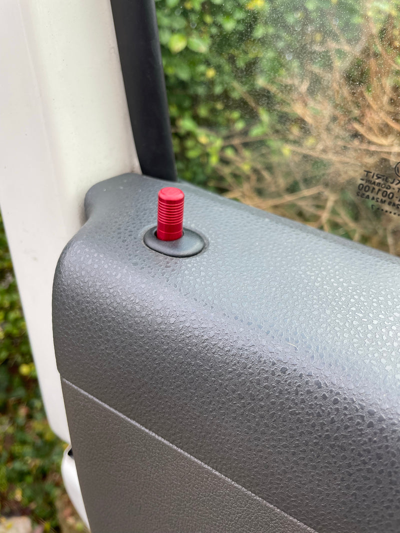 Red aluminium door lock pins on a T5