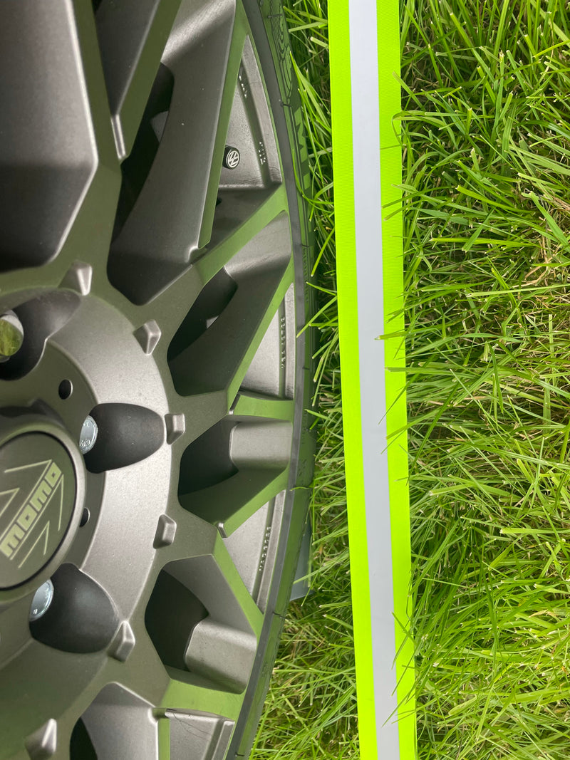 Close up of reflective realignment strip lined up with alloy wheel